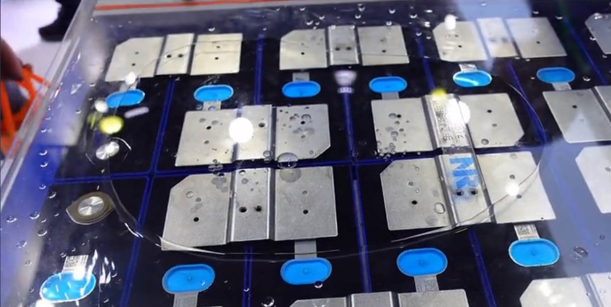 Fully submerged liquid-cooled energy storage